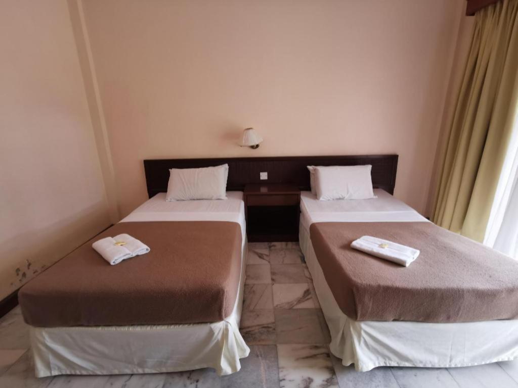 Oyo 89972 Borneo Paradise Beach Hotel Kota Kinabalu Bagian luar foto